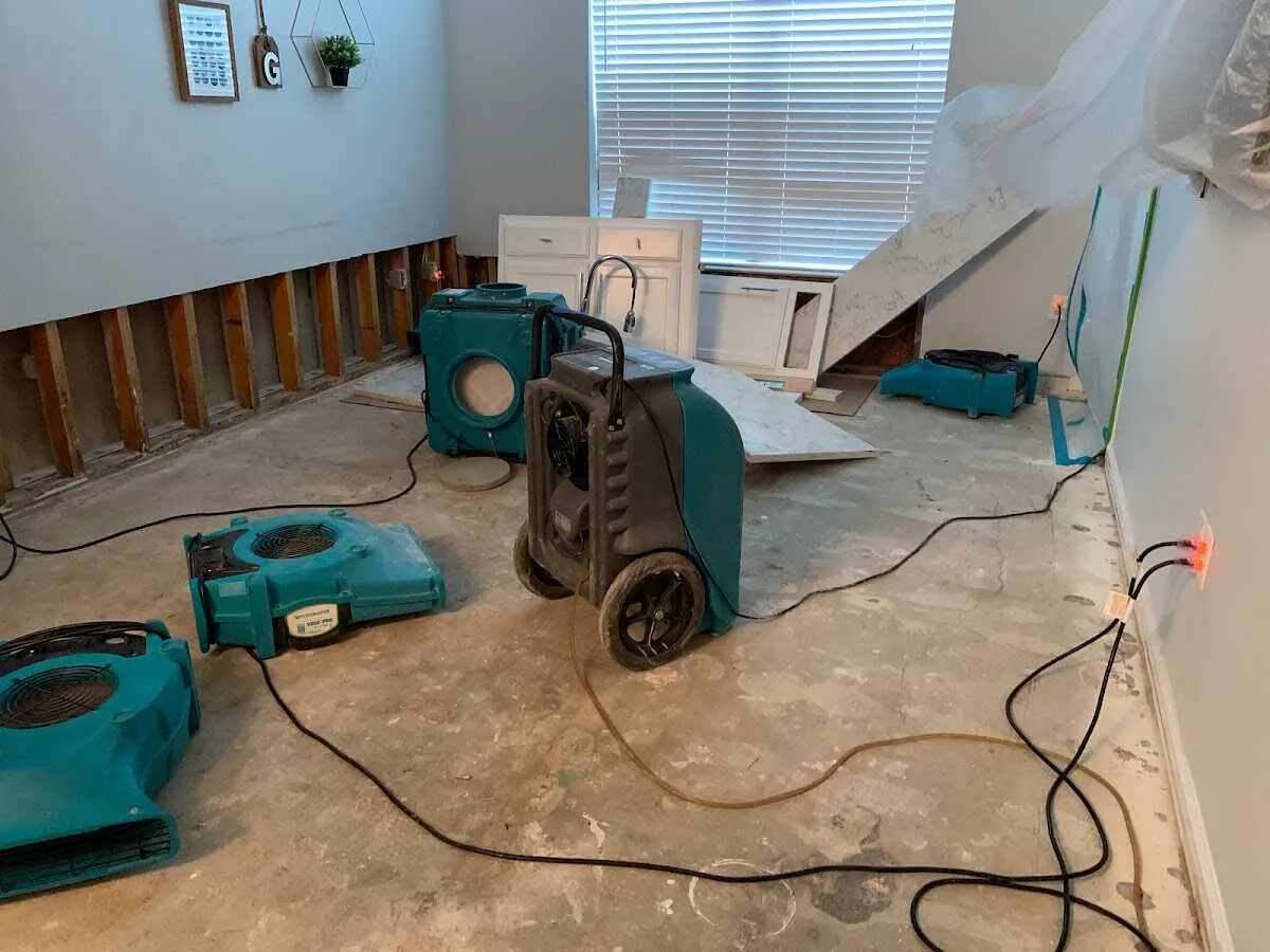 Dehumidifier in flood-cut room for Water Damage Restoration in Mustang
